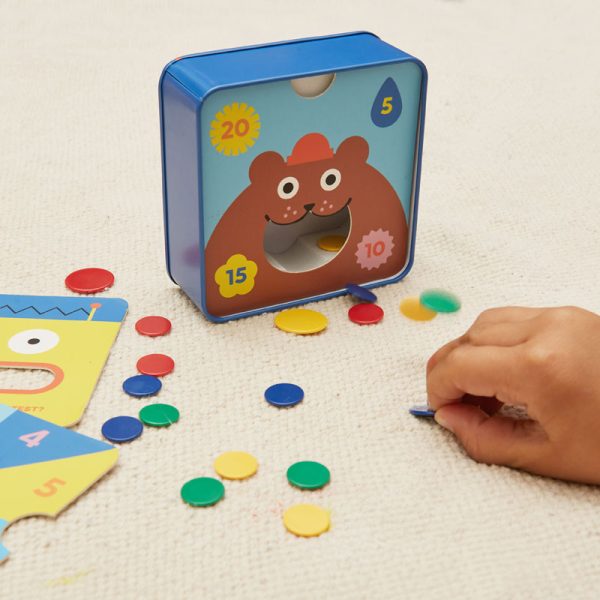 Сладка игра за сръчност Tiddlywinks- вкарай диска в устата на мече.